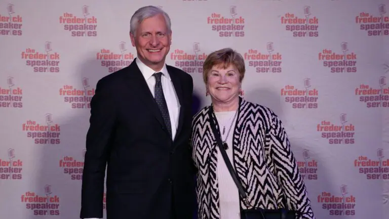 Mary Pivec and Jon Meacham standing together